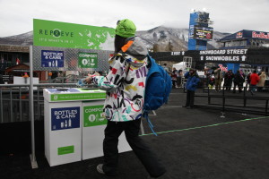 A fan recycling at one of the REPREVE recycling stations at the X Games