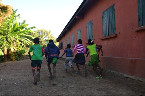 Pupils playing in the cleaned area behind the school building that had previously been used for open defecation. Tsimahavaobe primary school, Morondava commune, Menabe region, Madagascar. July 2013