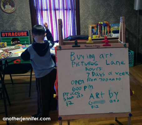 We've turned part of our second floor into an art studio and "store." G made the sign with Biz's direction.