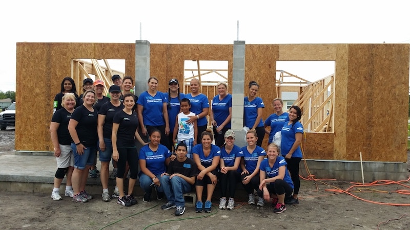 The building crew for Maria's house included Maria's supportive co-workers and local Lowe's employees. photo credit: Habitat for Humanity